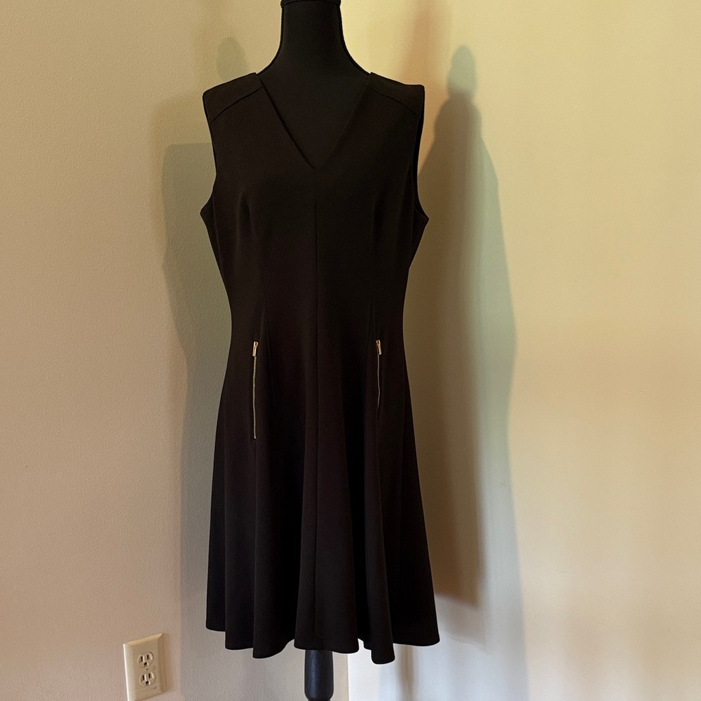 Classic Black Sleeveless V-Neck Mini Dress with Zip Pocket Details